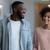 IVF & Assisted Reproduction: a happy couple holding hands in a fertility clinic, symbolizing hope and successful treatment
